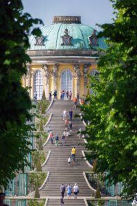Day Trips from Berlin - a group of people walking up a set of stairs