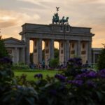 white concrete building near green grass field during daytime
